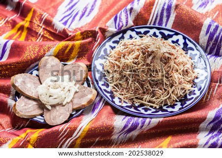 Uzbek national food norin on national fabric