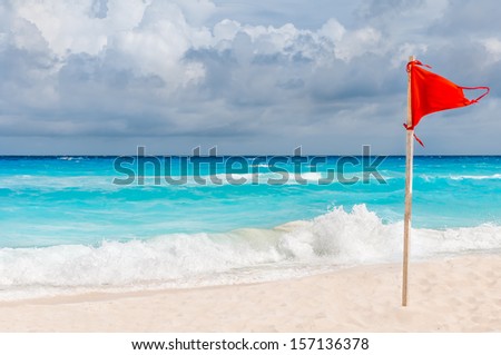 Red flag on the beach.