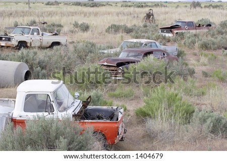 stock photo Abandoned cars in field