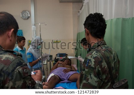 YALA, THAILAND - FEB 23: Unidentified soldier injury from time bomb explode on bed in emergency room on Feb 23, 2012 at Yaha Hospital Yala, Thailand