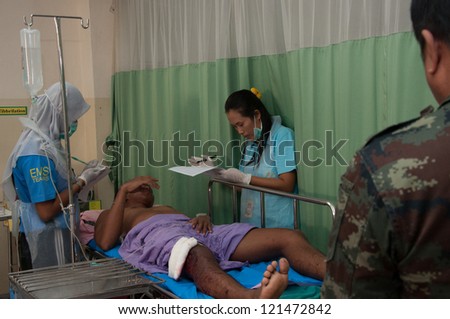 YALA, THAILAND - FEB 23: Unidentified soldier injury from time bomb explode on bed in emergency room on Feb 23, 2012 at Yaha Hospital Yala, Thailand