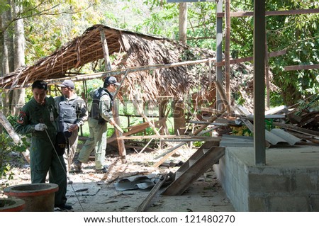YALA, THAILAND - FEB 23: Explosive Ordnance Disposal Police search for time bomb after time bomb explode on Feb 23, 2012 at Yaha Samukkee School Yala, Thailand