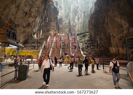 Kuala Lumpur, Malaysia - SEPTEMBER 27: Tourists come to visit inside Batu Caves on Sep 27, 2013 in Batu Caves, Kuala Lumpur, Malaysia