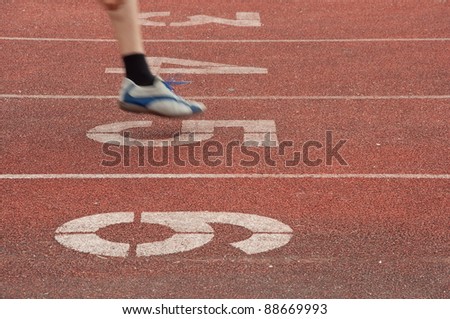 Running track with runner