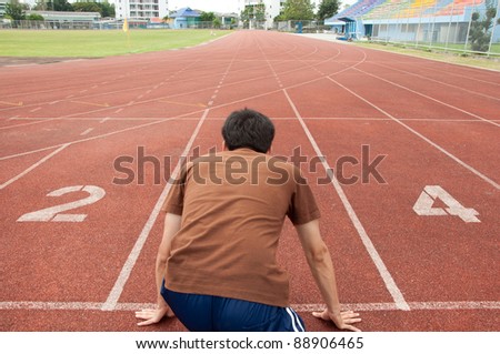 asian man runner on running track