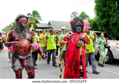 YALA, THAILAND - SEPTEMBER 27:  Unidentified men dress fancy ghost for fancy ghost parade in Yala Cave Temple Buddhism Day on Sept 27, 2011 at Cave Temple Yala, Thailand