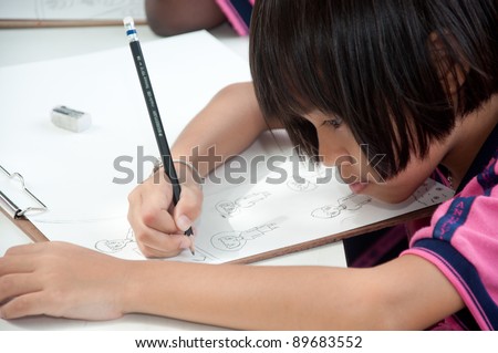 YALA, THAILAND - SEPTEMBER 26: Unidentified student draws picture for Cave Temple Painting Contest on September 26, 2011 at Cave Temple Yala, Thailand.