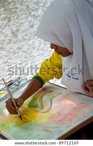 YALA, THAILAND - SEPTEMBER 26: Unidentified student draws picture for Cave Temple Painting Contest on September 26, 2011 at Cave Temple Yala, Thailand.