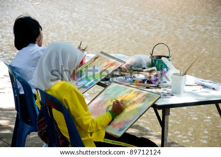 YALA, THAILAND - SEPTEMBER 26: Unidentified students draw pictures for Cave Temple Painting Contest on September 26, 2011 at Cave Temple Yala, Thailand.