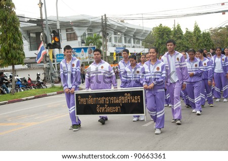 YALA, THAILAND - DECEMBER 5:Unidentified Sirindhorn college of public health students walk in the H.M.K. Bhumibol Adulyadej Birthday ceremony on Dec 5, 2011 at Yala Youth Center, Thailand