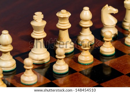 Closeup white king and queen Set of chess figures on the playing board