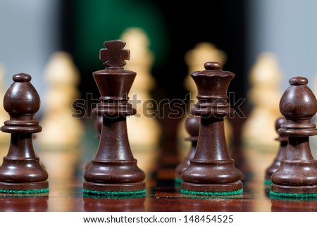 Closeup black king and queen Set of chess figures on the playing board