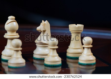 Closeup white bishop horse and tower Set of chess figures on the playing board