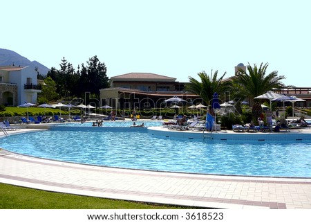 Swimming pool with tourists hotel Rethymnon Crete