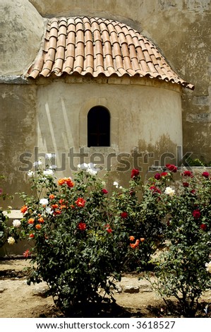 Crete Arkadi convent church window and flowers
