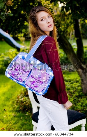 Back to school fashion girl showing bags and accessories