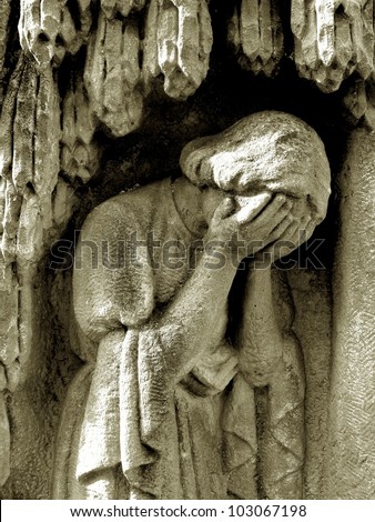 crying stone/photo of a sad woman statue