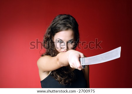 http://image.shutterstock.com/display_pic_with_logo/77170/77170,1171714341,1/stock-photo-beautiful-sexy-brunette-pointing-a-japanese-sword-at-camera-2700975.jpg