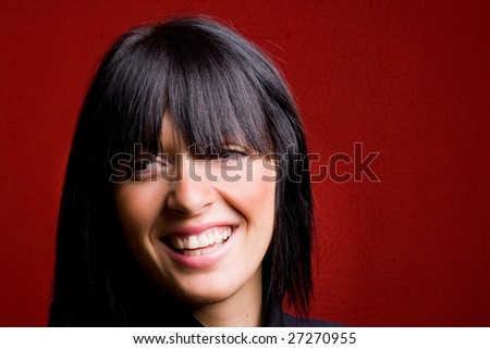 Portrait of a beautiful young lady smiling a toothy smile