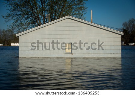Small building is surrounded by flood waters from the Wabash River in the small town of York, Illinois