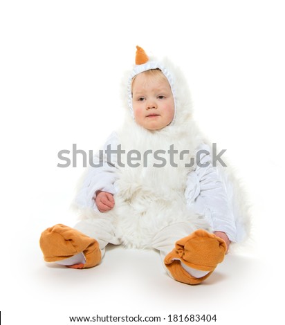 Cute 2-year-old blond baby boy in chicken suit on white background