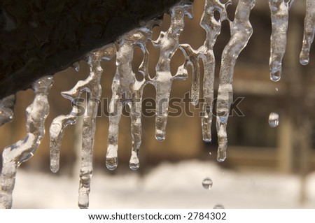 Icicles hang off of a decorative structure following an ice storm