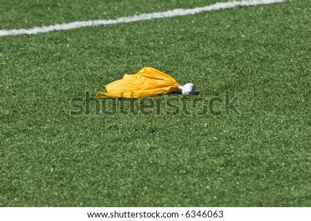 A flag is called on a play during an American football game.