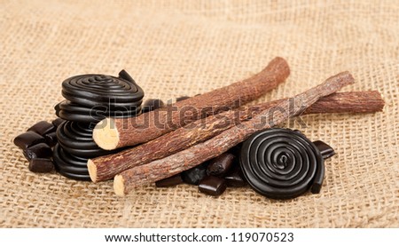 licorice candy and licorice  wheels isolated on white