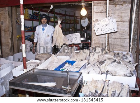 PALERMO - DECEMBER 22: men selling cod on the local market in Palermo, called Ballaro. This market is also tourist attraction in Palermo, Sicily, Italy on Dec. 22, 2012.