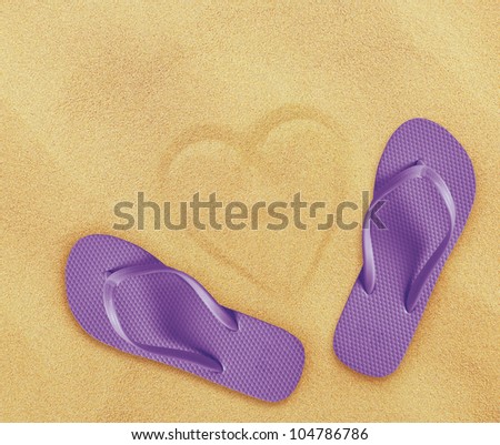 a pair of flip flops on the beach sand, Summer back concept.