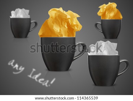 Crumpled colorful papers with coffee on black desktop.