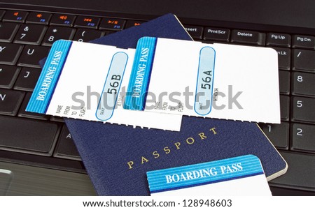 passport and boarding cards on a computer