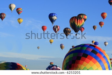 Balloons rising in the morning sun