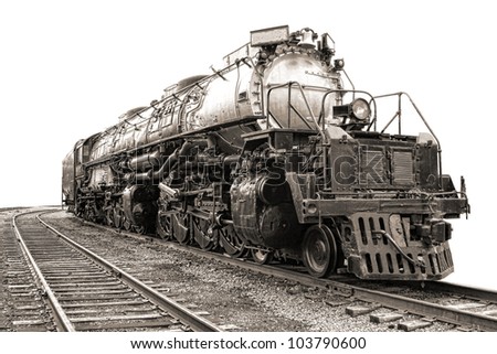 Vintage steam engine railroad freight train locomotive heavy duty type 4884 big boy on old rail tracks in nostalgic sepia