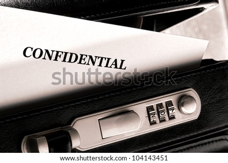 Confidential document letter sticking out of a little ajar open briefcase during a top secret classified information exchange and review meeting