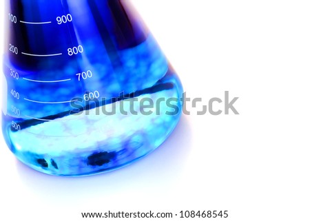 Scientific laboratory glass conical Erlenmeyer flask with blue chemical liquid element suspension for a chemistry experiment in a science research lab Scientific laboratory glass conical Erlenmeyer flask with blue chemical liquid element suspension for a chemistry experiment in a science research lab