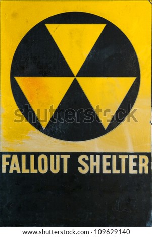 Vintage grunge Cold War era civil defense fallout shelter refuge sign for emergency and nuclear attack protection