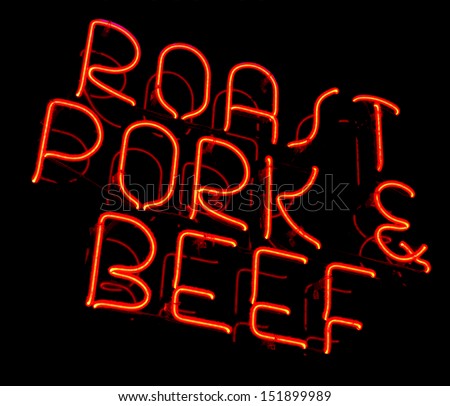 Roast pork and beef old and dusty vintage fluorescent neon store sign at a meat market