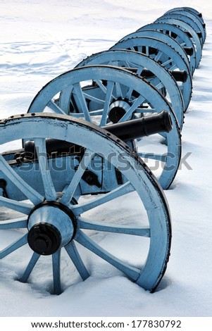 American Revolutionary War cannons battery in an artillery position in winter snow at Valley Forge National Historical Park military camp of the Continental Army near Philadelphia in Pennsylvania