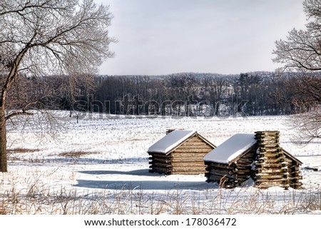 American Revolutionary War soldier wood cabins landscape in encampment in winter snow at Valley Forge National Historical Park military camp of the Continental Army near Philadelphia in Pennsylvania