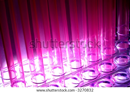 Plastic laboratory test tubes on a rack in a science research lab