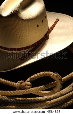 American West rodeo cowboy white straw hat and lasso