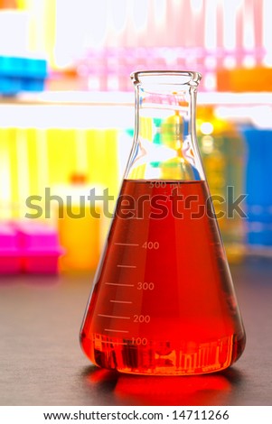 Scientific laboratory glass conical Erlenmeyer flask filled with chemical liquid for a chemistry experiment in a science research lab