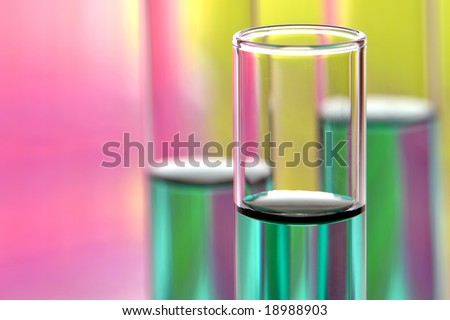Laboratory glass test tubes filled with green liquid for an experiment in a science research lab