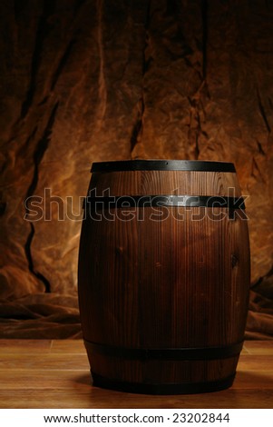 Old fashioned antique whisky or wine cask wood barrel in nostalgic antique brown decor