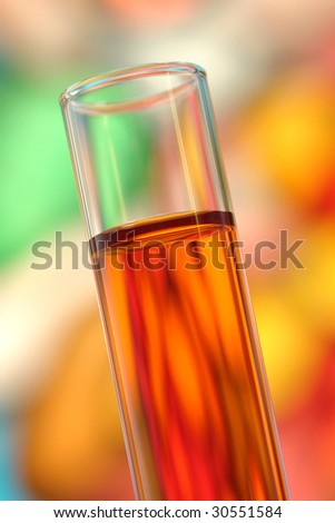 Laboratory glass test tube filled with red orange liquid for an experiment in a science research lab