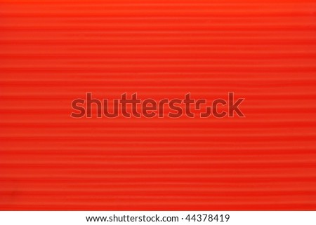 Neon bright orange color corrugated plastic surface background
