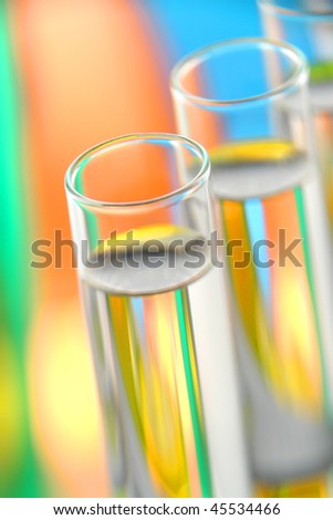 Laboratory glass test tubes filled with clear liquid for an experiment in a science research lab