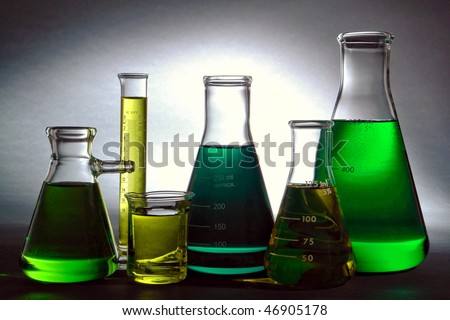 stock photo : Glass Erlenmeyer flasks and beakers filled with liquid for an 