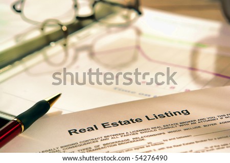 Real estate listing contract on a realtor agent marketing presentation binder